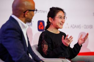Speaker smiling while speaking at Financial Crime 360