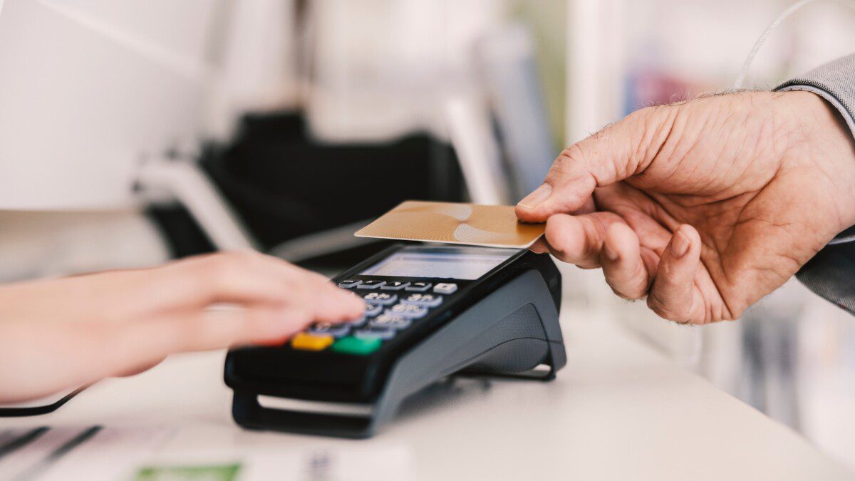 Customer paying with card on PoS terminal