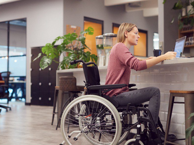 Wheelchair user engaged in a working environment