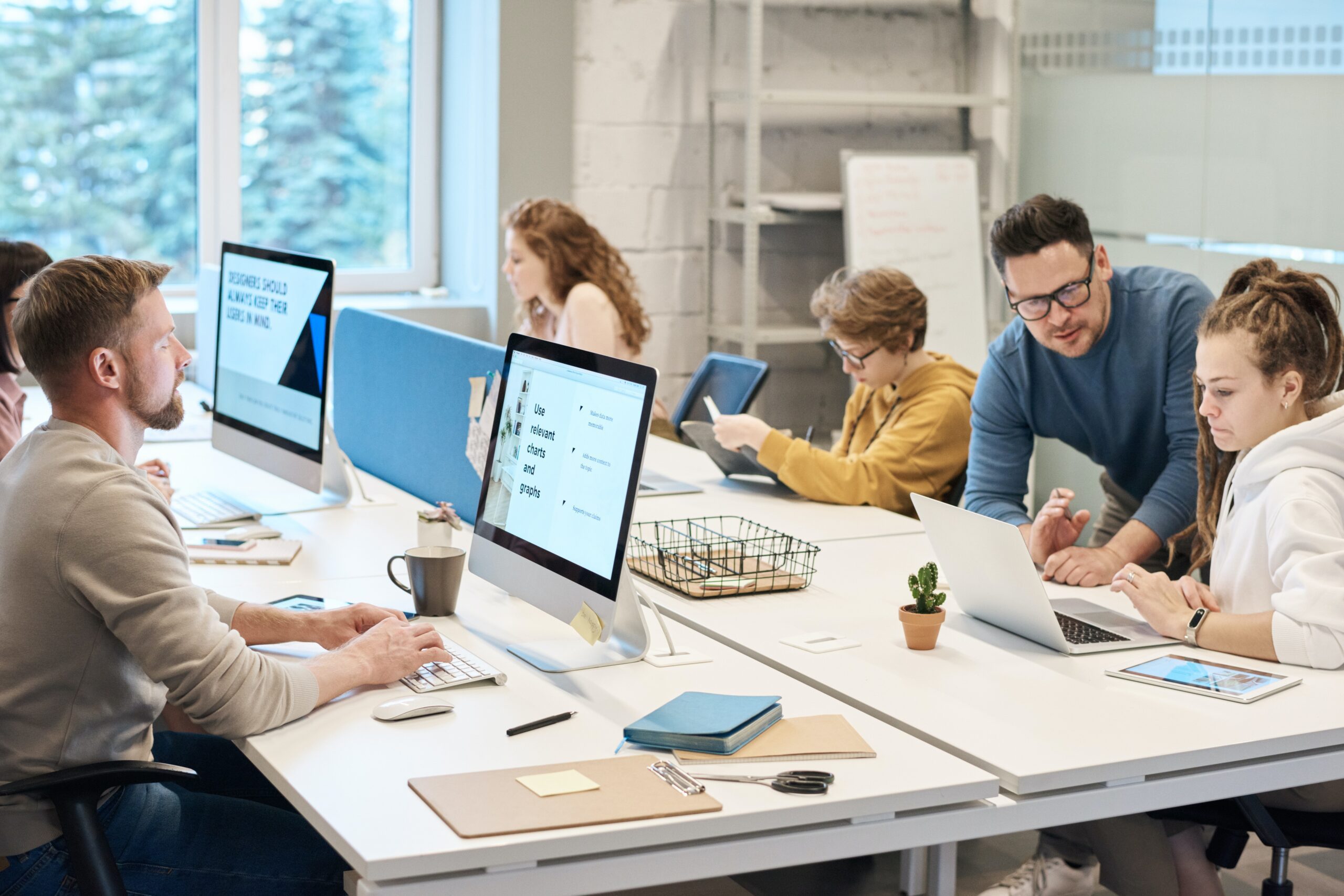 Office workers sat around a large desk