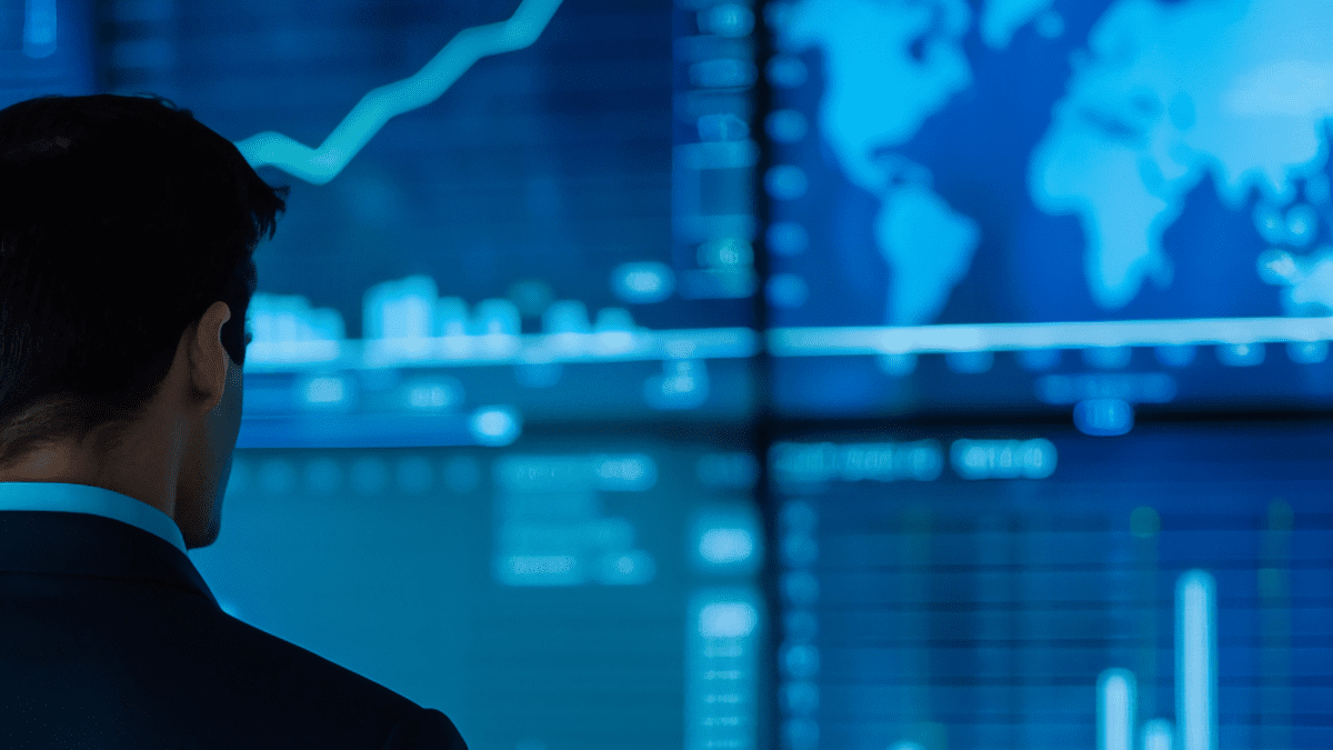Picture of a man looking at graphs, reflecting leadership
