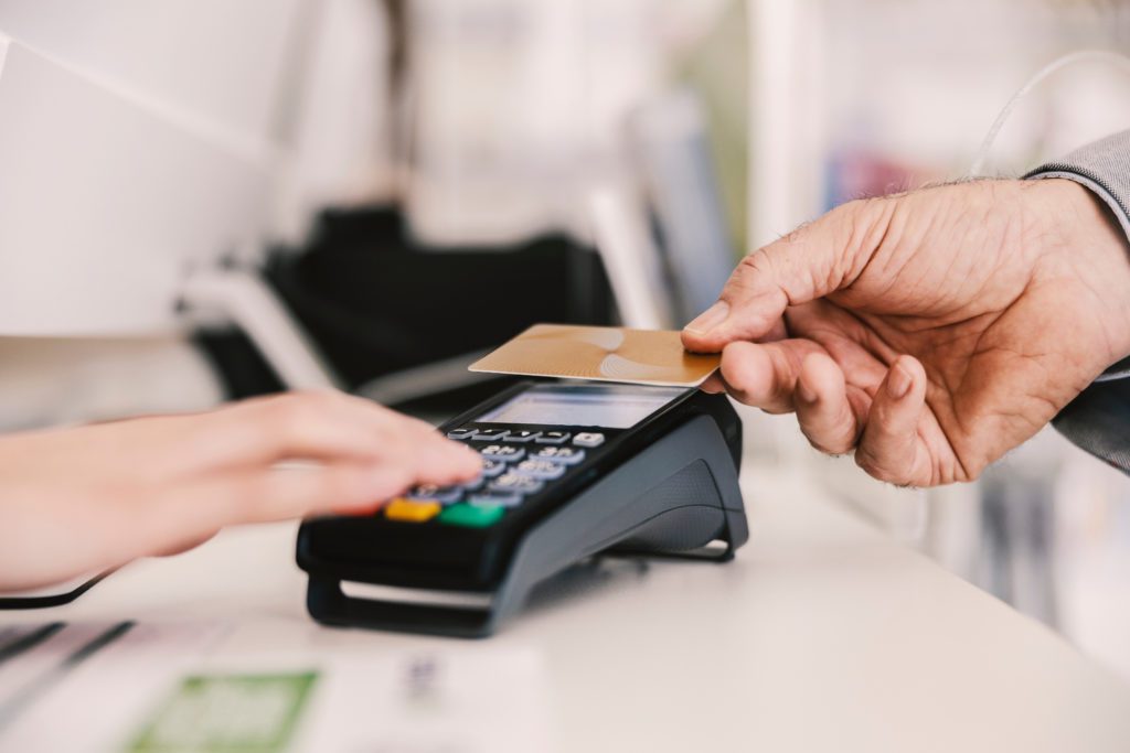 Customer paying with card on PoS terminal